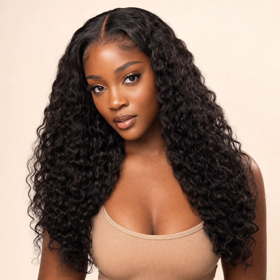 Black woman wearing a natural black 13x6 HD lace deep wave human hair wig, front view